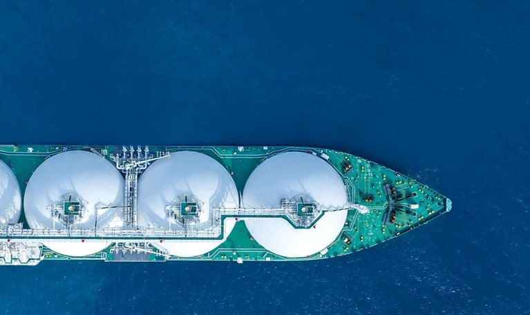 LNG (Liquified Natural Gas) tanker sailing a vast ocean scene