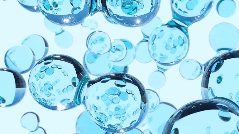 Digital generated image of transparent blue hydrogen atoms against white background.