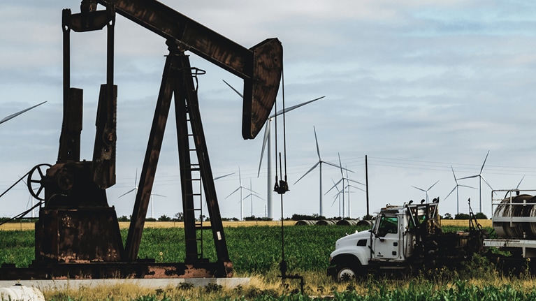 Oil rig drilling amongst crops
