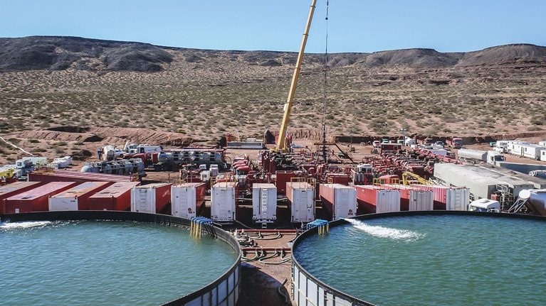 Vaca Muerta, Argentina, August 26, 2014: Extraction of unconventional oil. Battery of pumping trucks for hydraulic fracturing (Fracking).