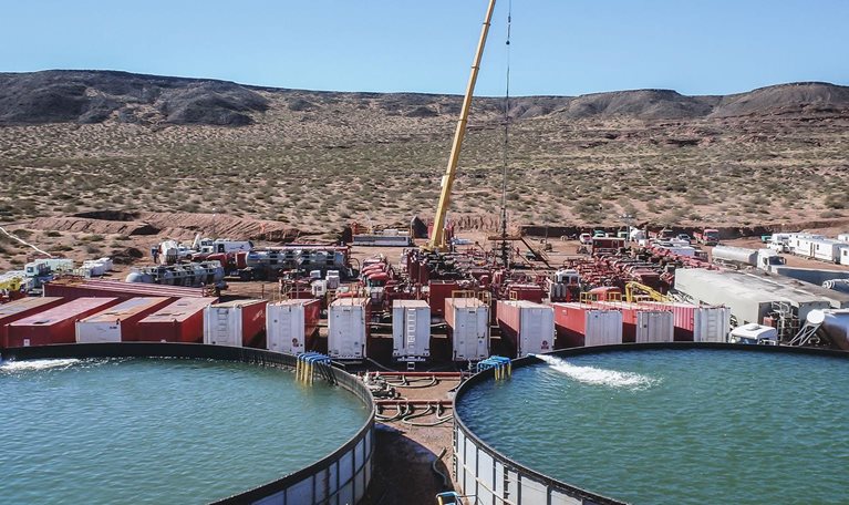 Vaca Muerta, Argentina, August 26, 2014: Extraction of unconventional oil. Battery of pumping trucks for hydraulic fracturing (Fracking).