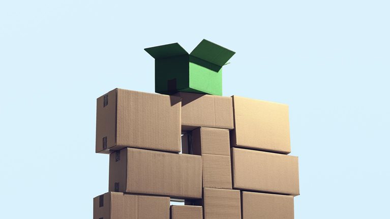 A large pile of cardboard boxes stacked on top of each other