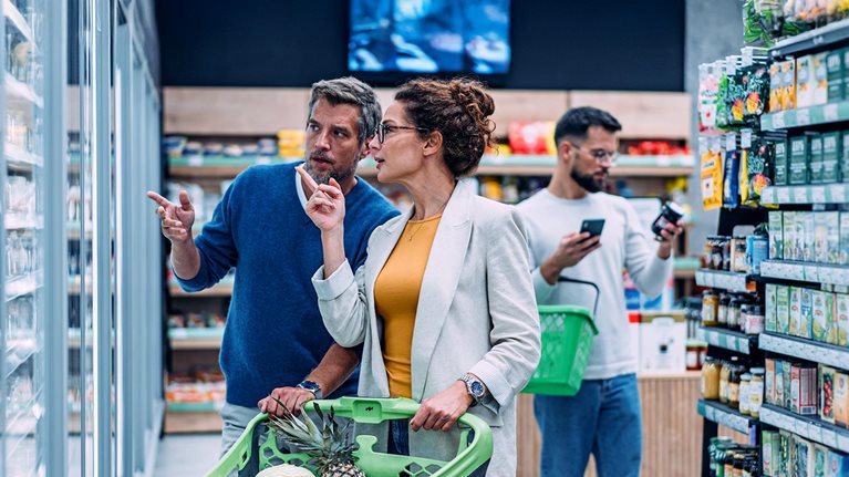 Couple shopping in a grocery store.