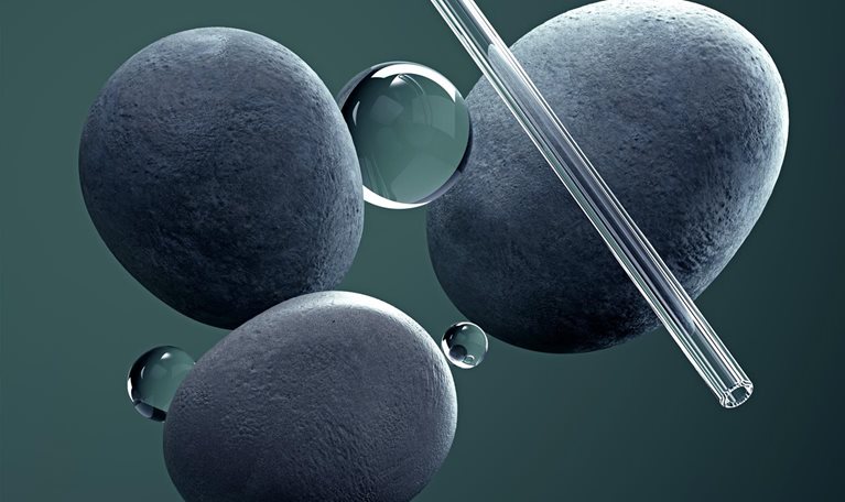 Digital generated image of a small glass spheres and pipes balancing on circular stones on green background
