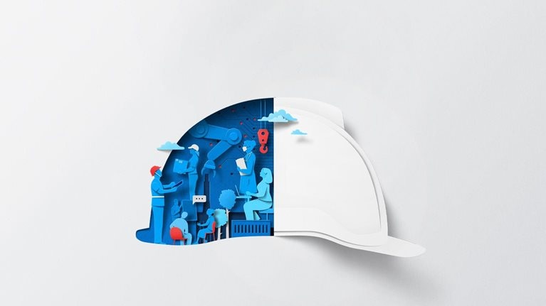 A white sheet of paper has been cut and folded, creating the silhouette of a hard hat. The interior is filled with dynamic blue and red shapes representing workers who are interacting with technology and each other.