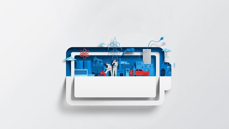 A white sheet of paper has been cut and folded in half, creating the silhouette of a battery symbol. Inside of the battery are vibrant blue and red-colored shapes representing various energy sources and infrastructure, including a nuclear power plant, power lines, and an electric vehicle charging station.