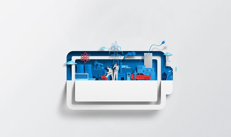 A white sheet of paper has been cut and folded in half, creating the silhouette of a battery symbol. Inside of the battery are vibrant blue and red-colored shapes representing various energy sources and infrastructure, including a nuclear power plant, power lines, and an electric vehicle charging station.