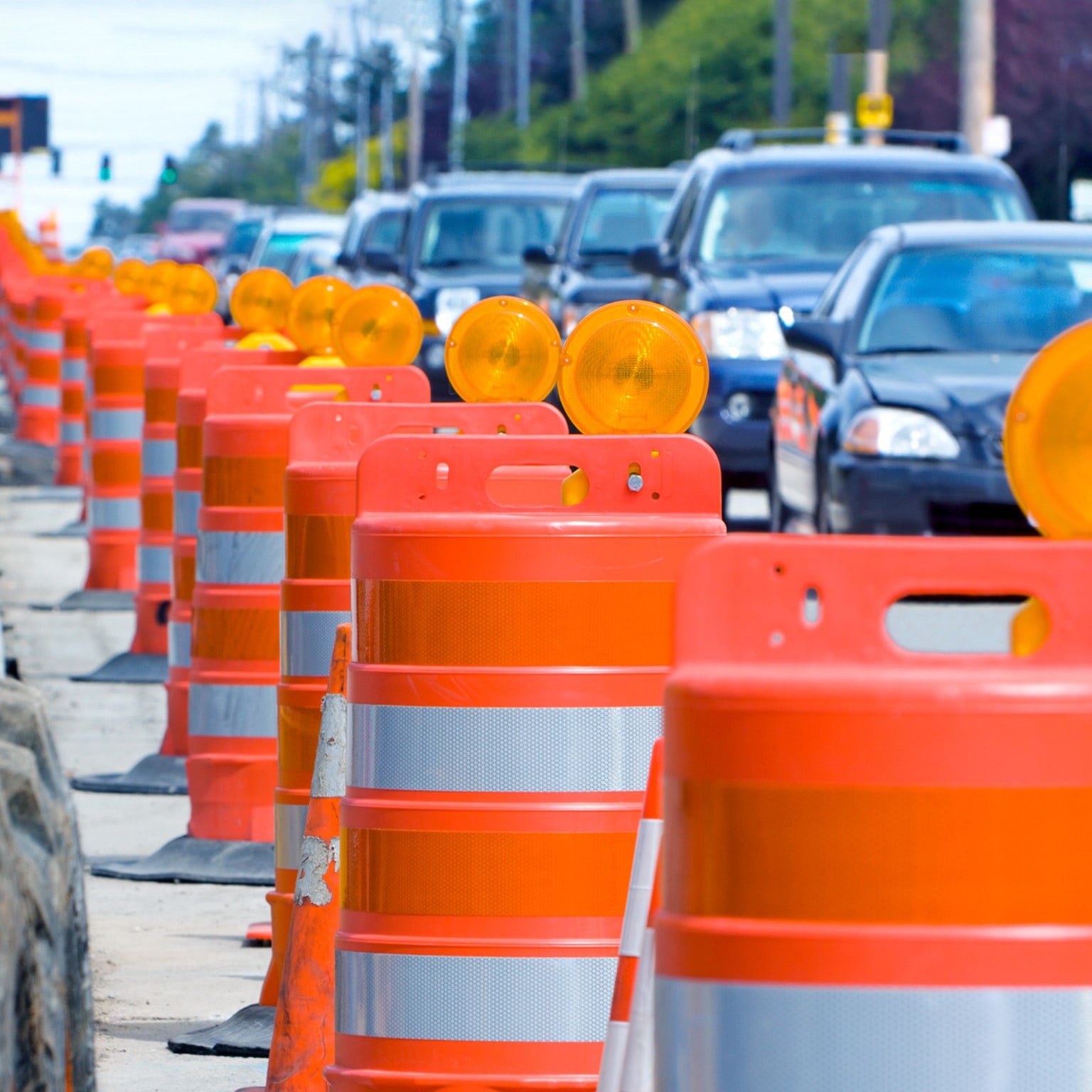 A row of bright orange construction barriers