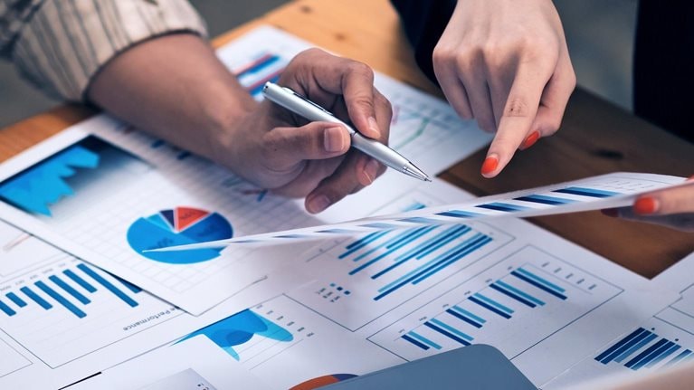 Business advisers meeting to analyze financial report in a meeting