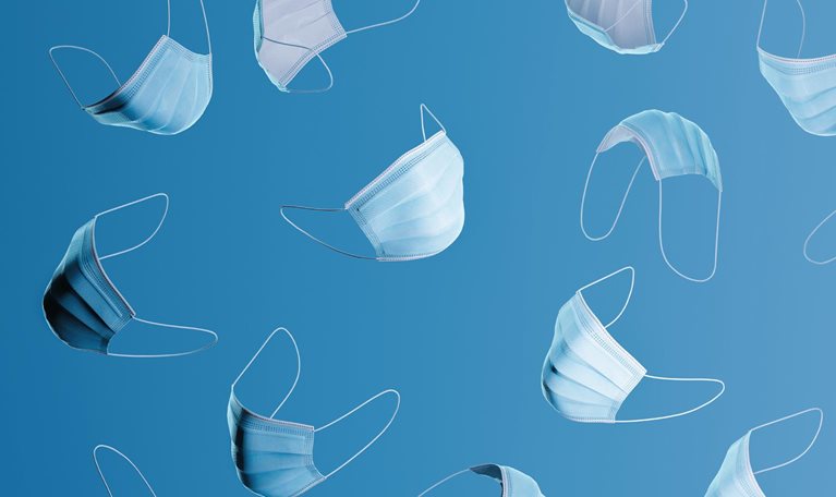 Many blue surgical masks floating on a blue background