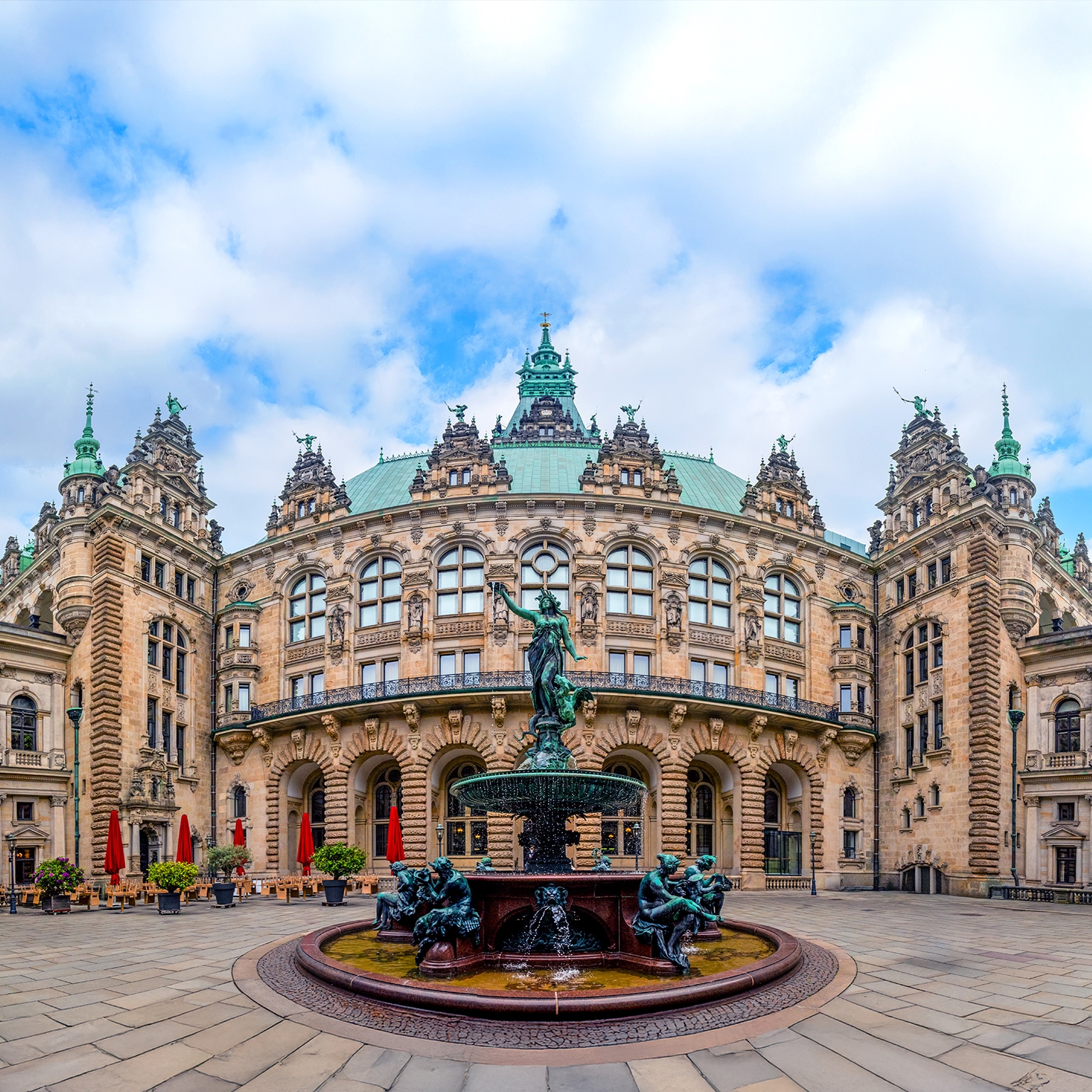 An image of the Hygieia Fountain located in the inner Courtyard of City Hall in Hamburg, Germany. It was built from 1895-1896 and designed by the sculptor Joseph von Kramer.