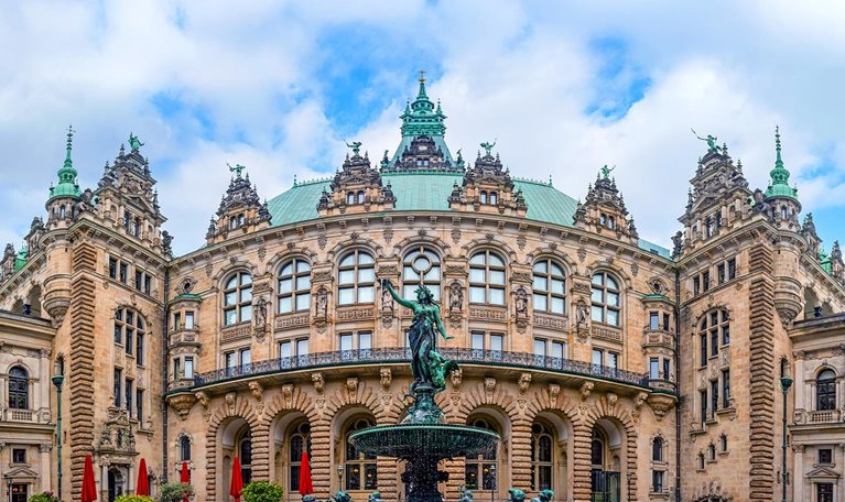 An image of the Hygieia Fountain located in the inner Courtyard of City Hall in Hamburg, Germany. It was built from 1895-1896 and designed by the sculptor Joseph von Kramer.