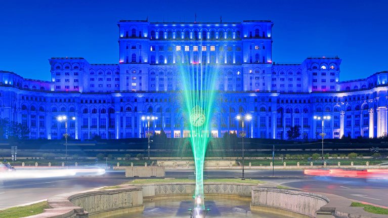 Sunset at the Palace of the Parliament in Bucharest, Romania bathed in blue light