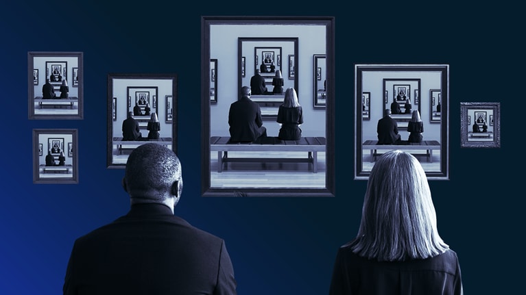 Photo of a seated man and woman viewing various portraits of their reflections