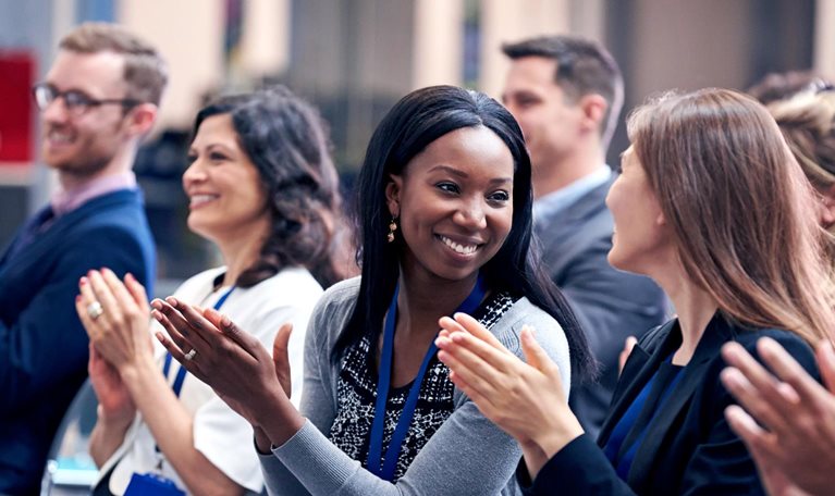 Audience Applauding Speaker After Conference Presentation