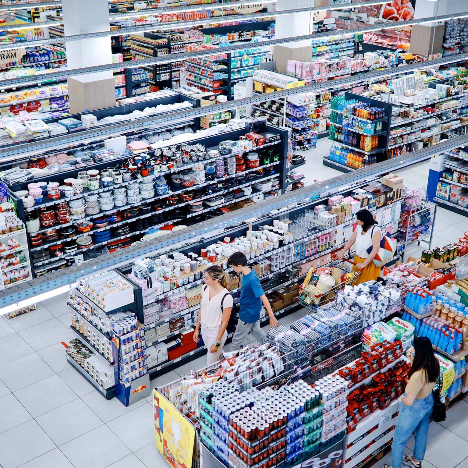 Overhead image of people buying in the large supermarket