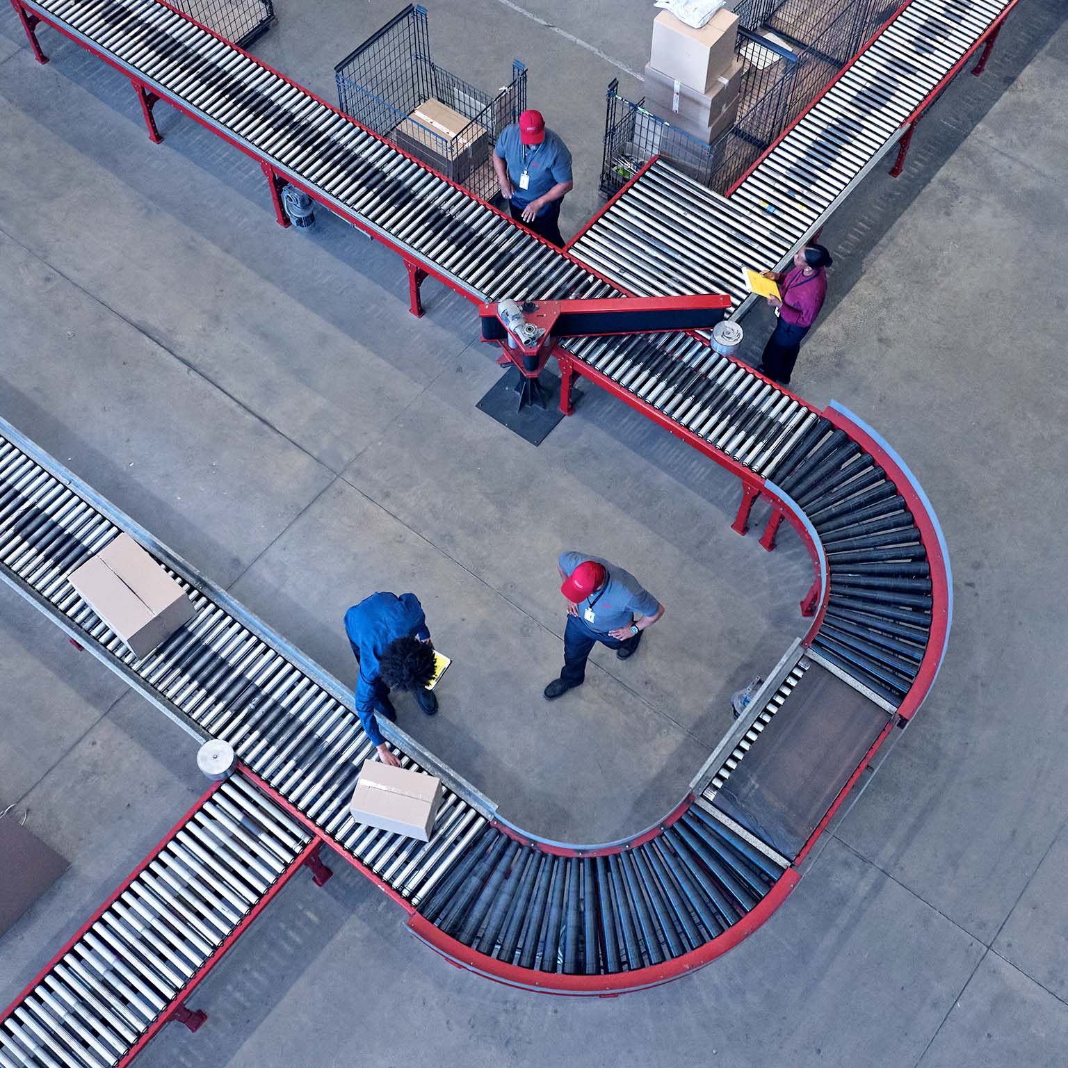Male and female worker working at conveyor belt