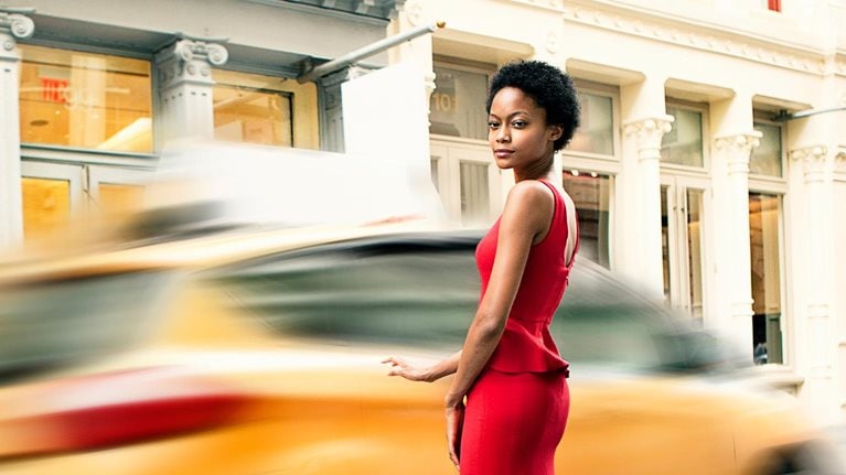 Woman wearing a red gown in Soho, New York