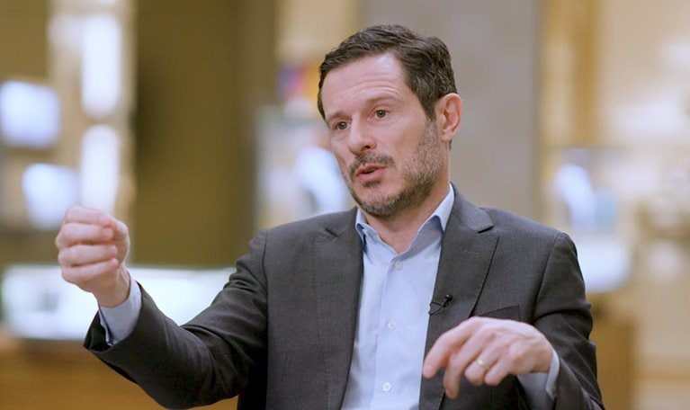 An image of Olivier Bron answering a question during an interview.