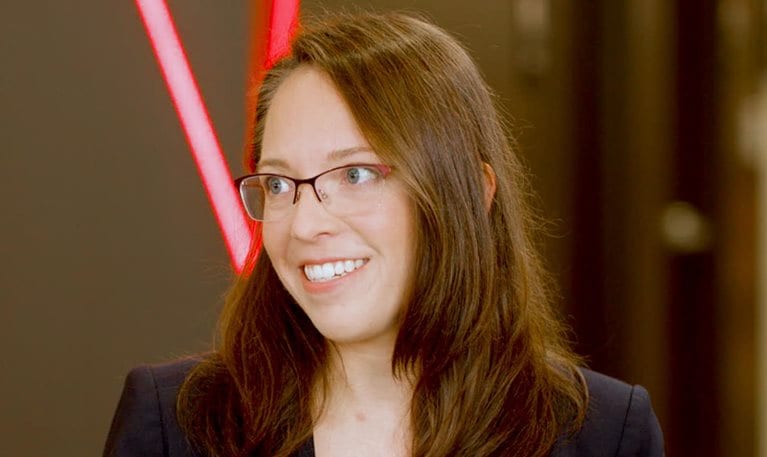 A still image of Ashley Fenn being interviewed.