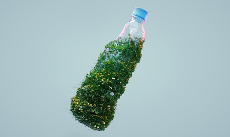 Digital generated image of grass and flowers growing on used plastic bottle against gray background.