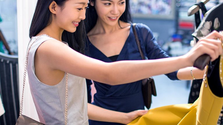 Two women shopping at a retail store
