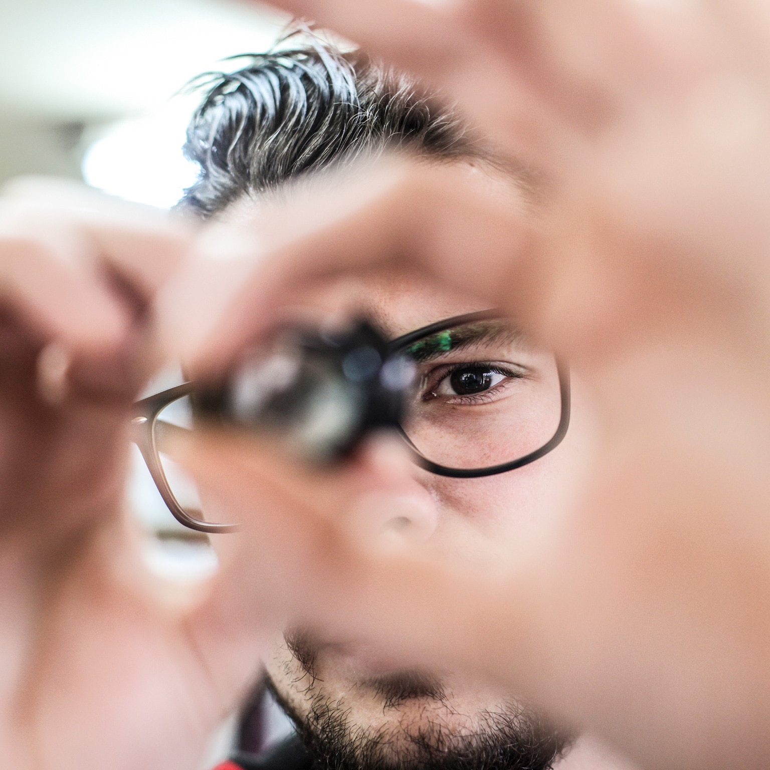 Worker looking at a microchip