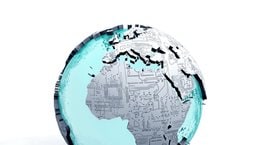 Continents embossed with computer motherboard print on a globe