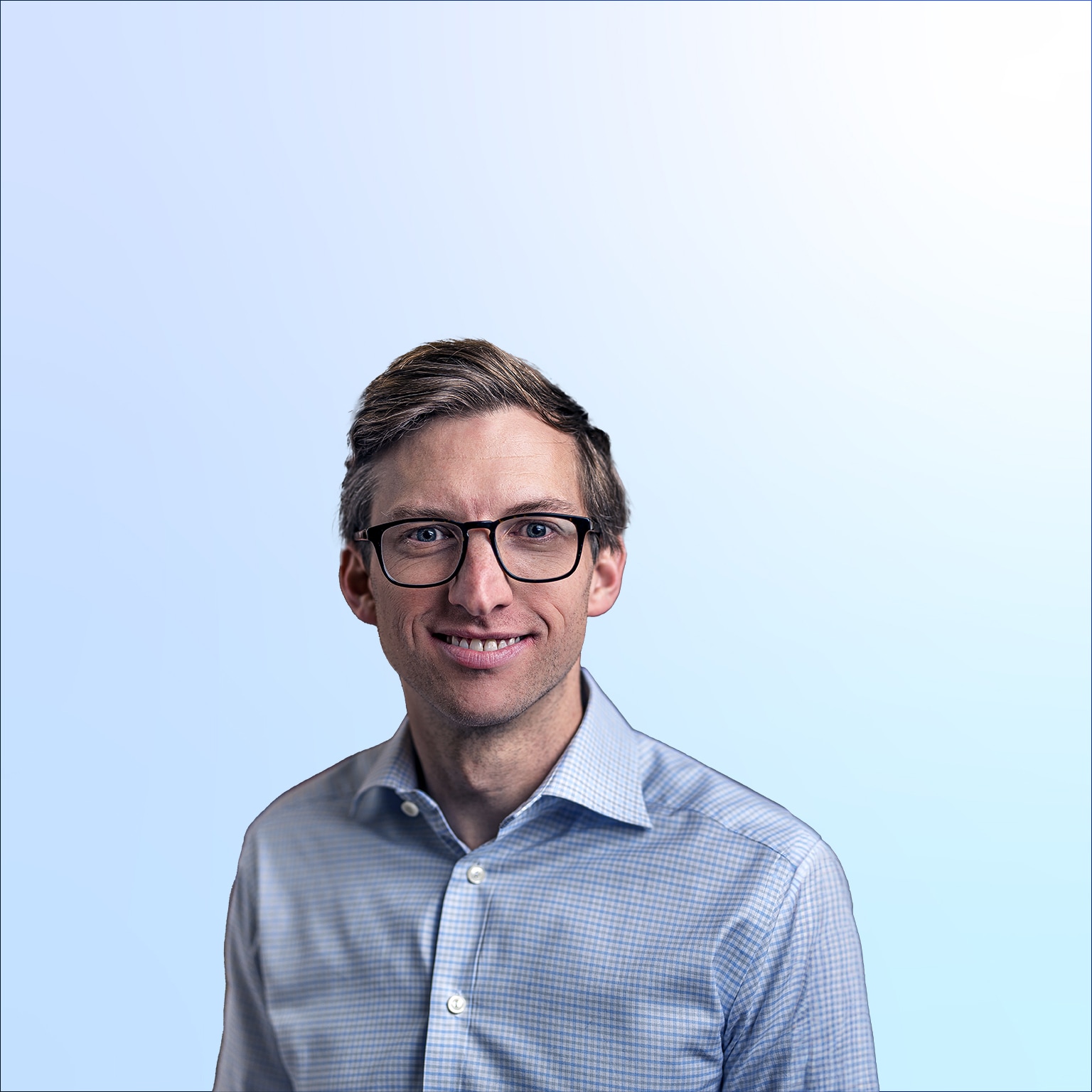 Chris Miller in a light blue shirt against a light blue background