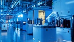 Wide shot inside advanced semiconductor production fab cleanroom