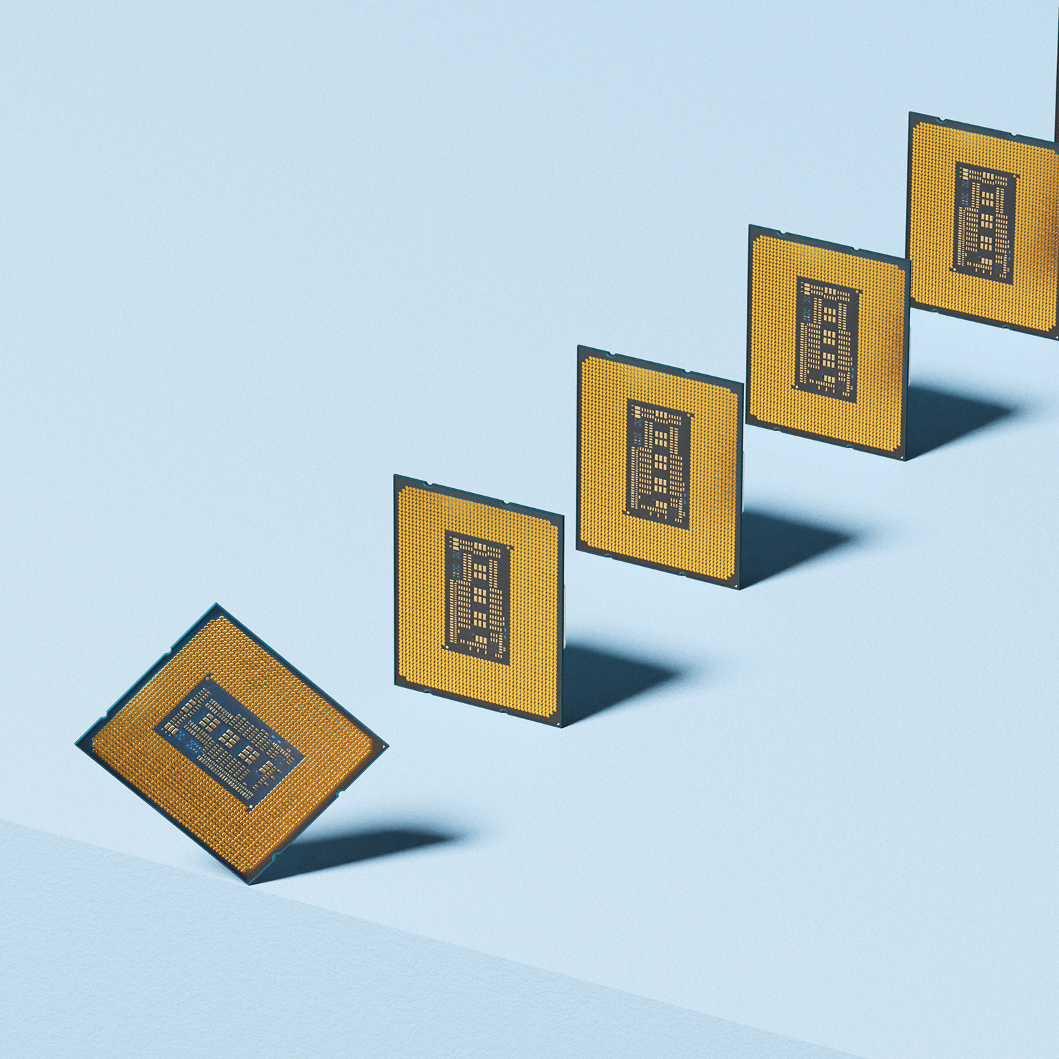 Broken supply chain. Conceptual image showing a lineup of microchips with one falling over the edge, could illustrate concepts around, chip shortage, supply and demand and semiconductor production.
