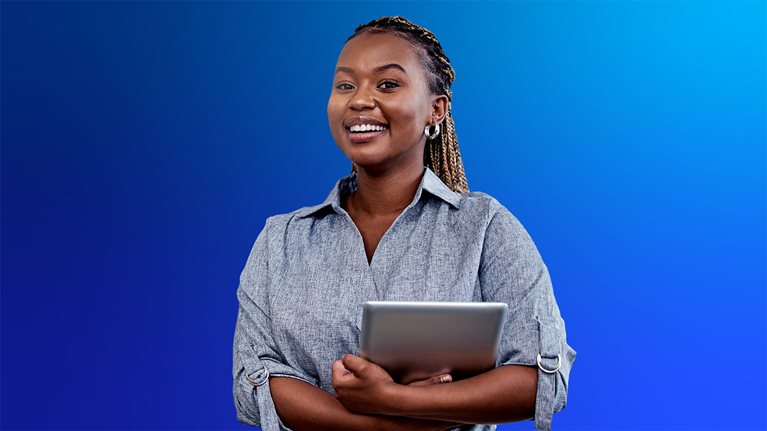 Cheerful black lady holding a laptop
