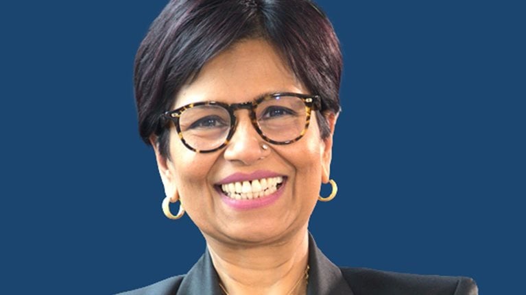 A smiling portrait of Amazon Web Services Managing Director, Tanuja Randery