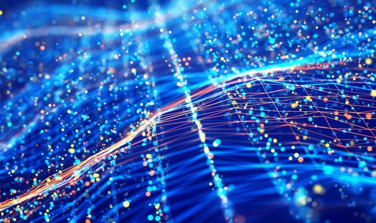 An digital illustration of an abstract network wave and glowing blue and orange particle data on dark background