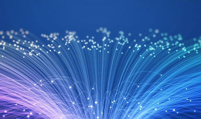 The image displays fiber optic cables, which are thin strands of glass or plastic used to transmit data as light signals.