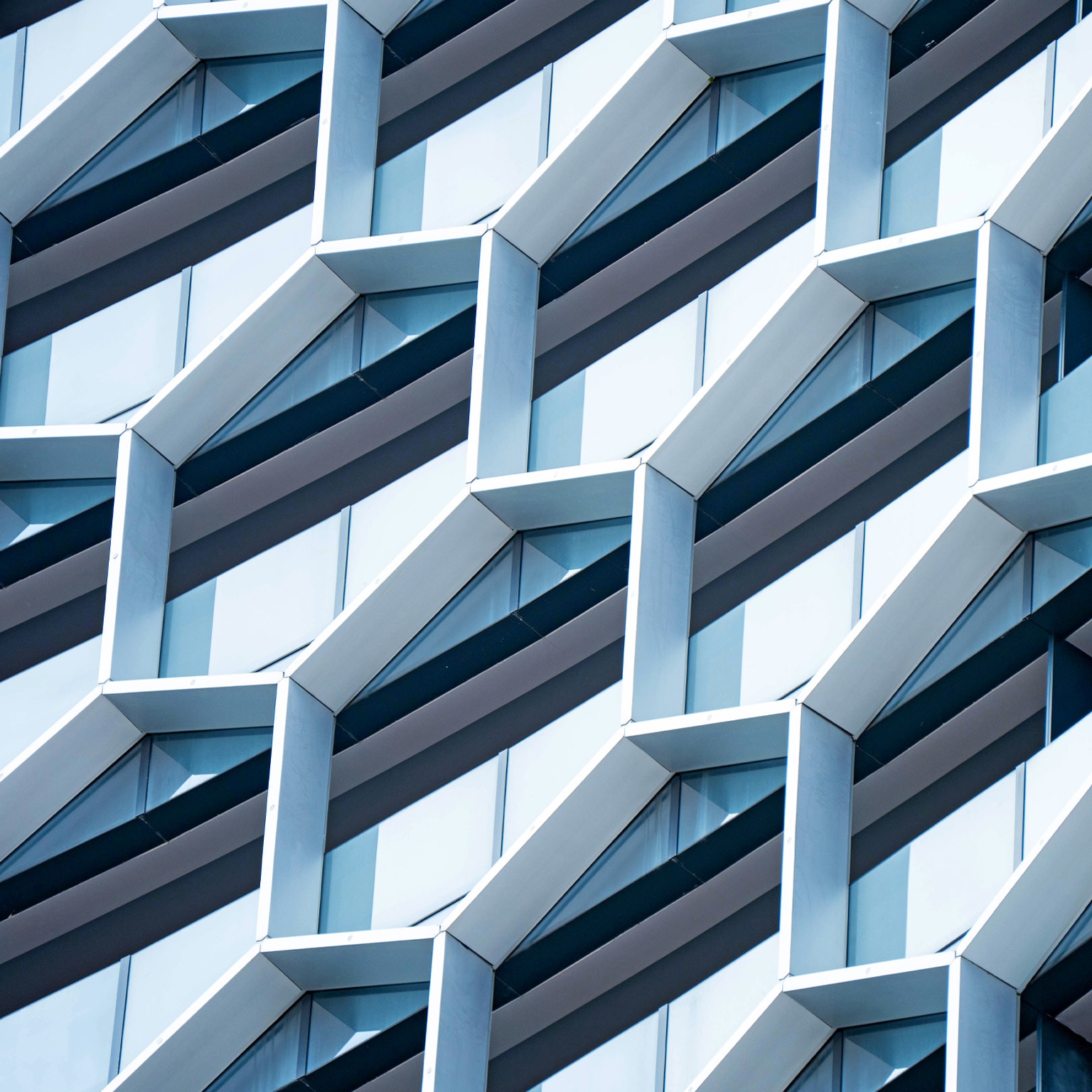 Detail of hexagon - shaped windows on a modern office building.