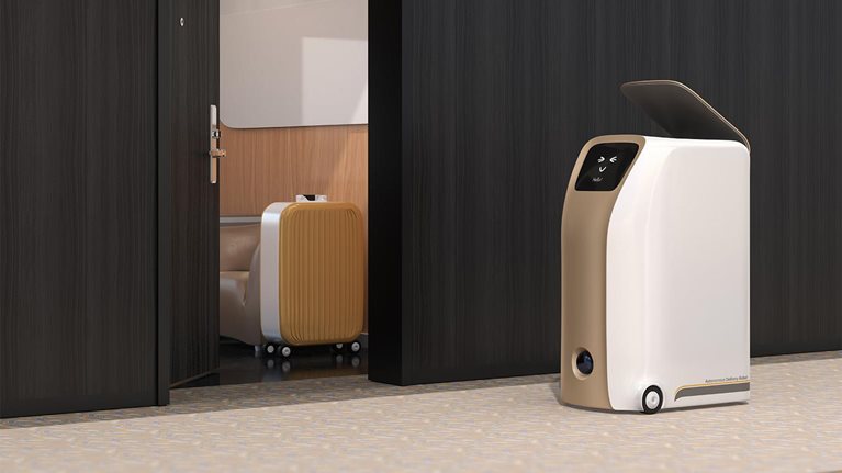 Delivery robot stopped beside room in hotel waiting for pick up - stock photo