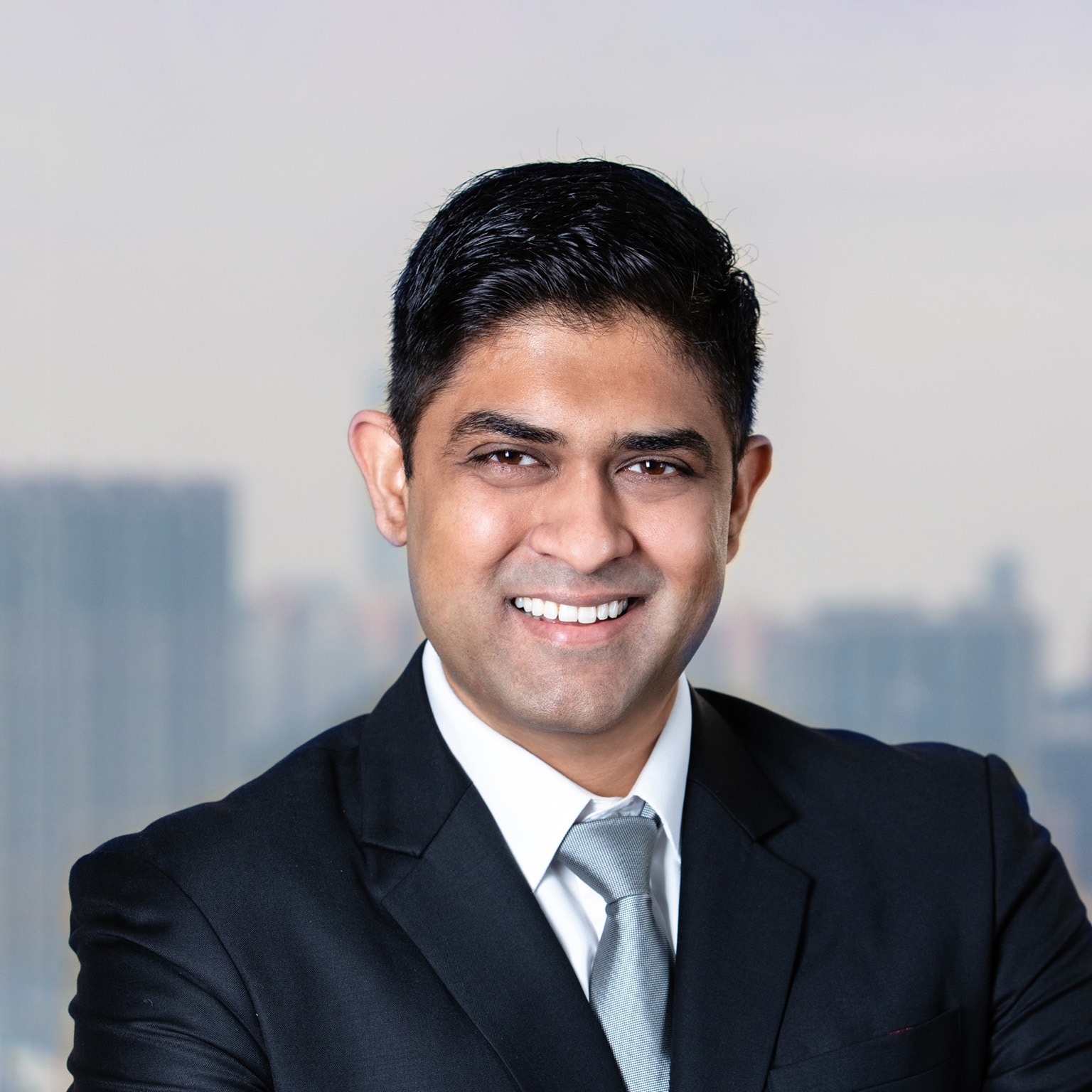 A smiling portrait of Akhil Nair