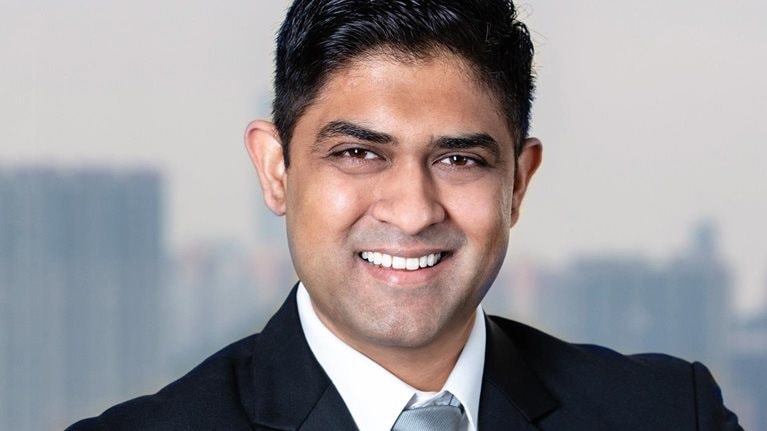 A smiling portrait of Akhil Nair