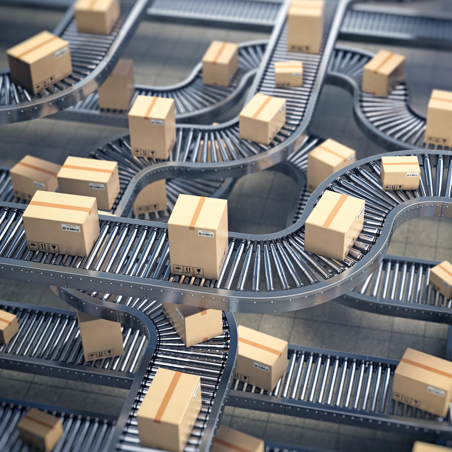 Cardboard boxes on conveyor roller in distribution warehouse