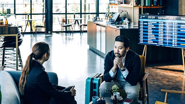 Businesspeople waiting for their flight at the airport business lounge