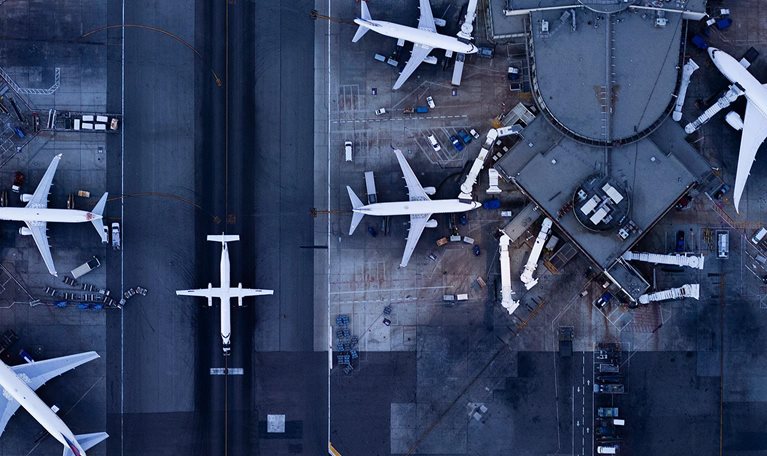 Airliners at gates and Control Tower at LAX - stock photo