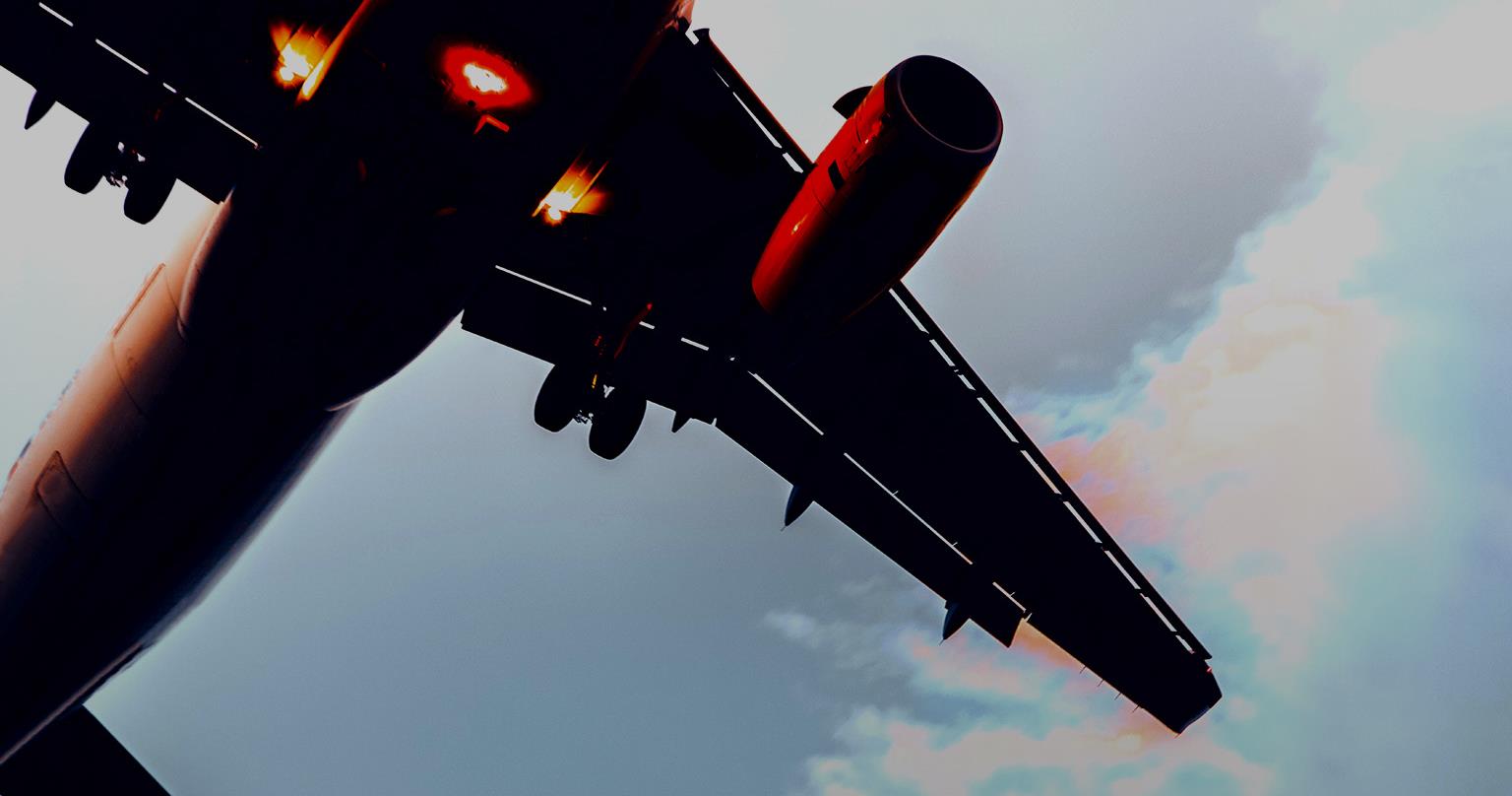 Approaching passenger aircraft at sunset