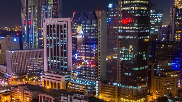 Manila, Philippines Makati timelapse aerial shot of Intersection in central city area with traffic. - stock video