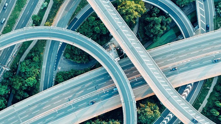 An aerial daytime view of a UK motorway intersection
