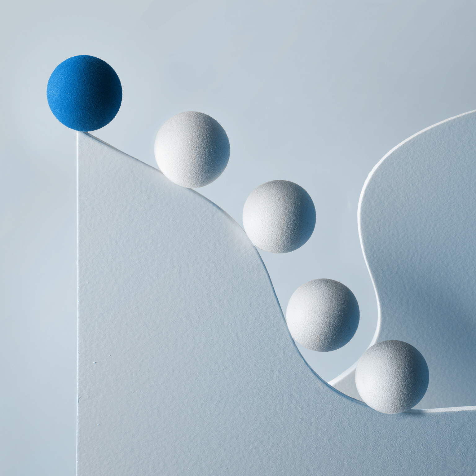 Several spheres following lead sphere along curvaceous path upward. - stock illustration
