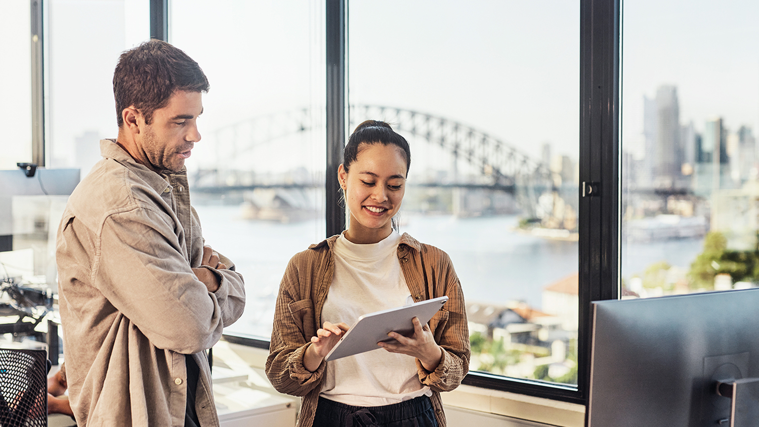 A diverse team of Australian professionals collaborating in a Sydney office.
