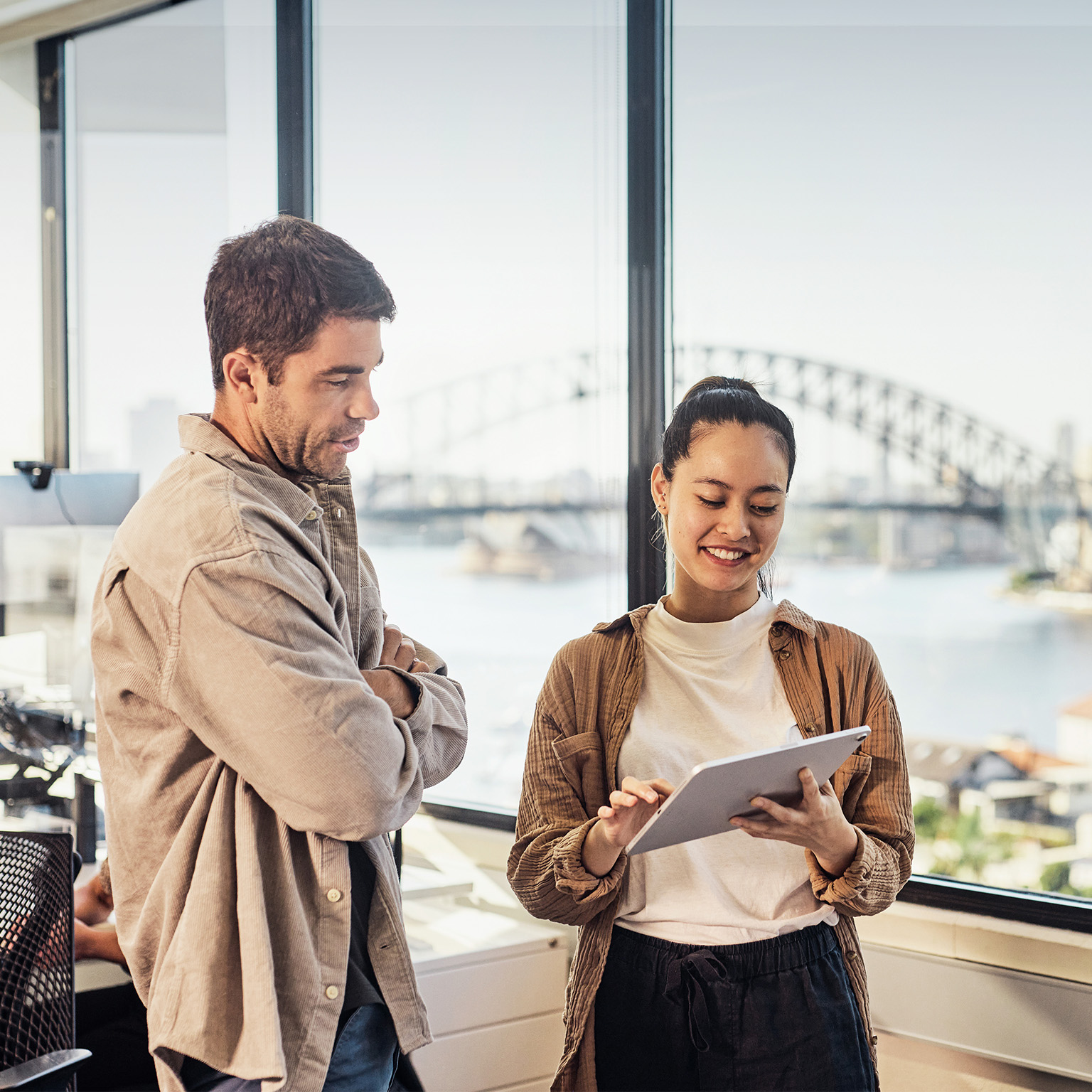 A diverse team of Australian professionals collaborating in a Sydney office.