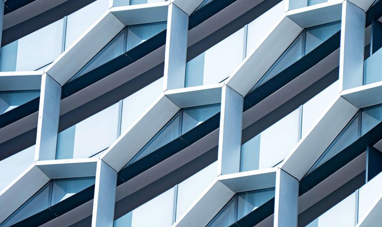 Detail of hexagon shaped windows on a modern office building.