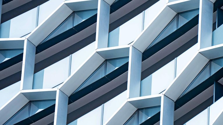 Detail of hexagon shaped windows on a modern office building.